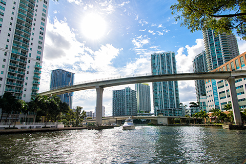 A stock photo of Downtown Miami from the Miami River in Miami, Florida.